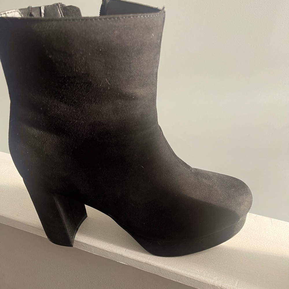 Black, used size 12 Torrid platform heeled booties ! Wide width as well.